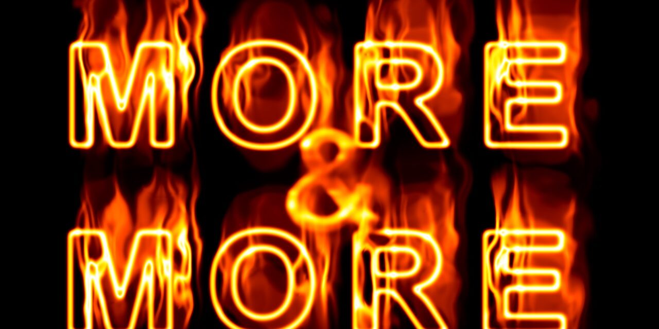 words 'more & more' in flames