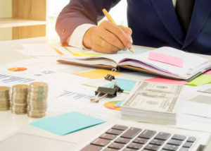 businessman working on accounting books