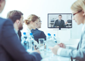 coworkers watching webinar